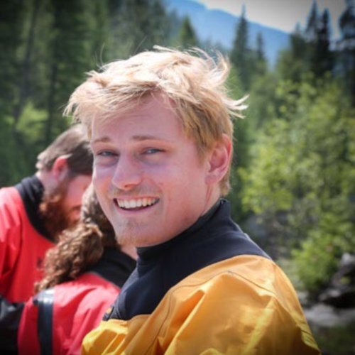 Idaho raft guide in yellow dry suit