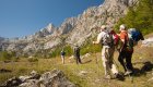 A group of hikers on a holiday in Europe trekking through the Peaks of the Balkans
