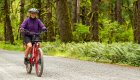 Woman biking along the Olympic Discovery Trail in Washington