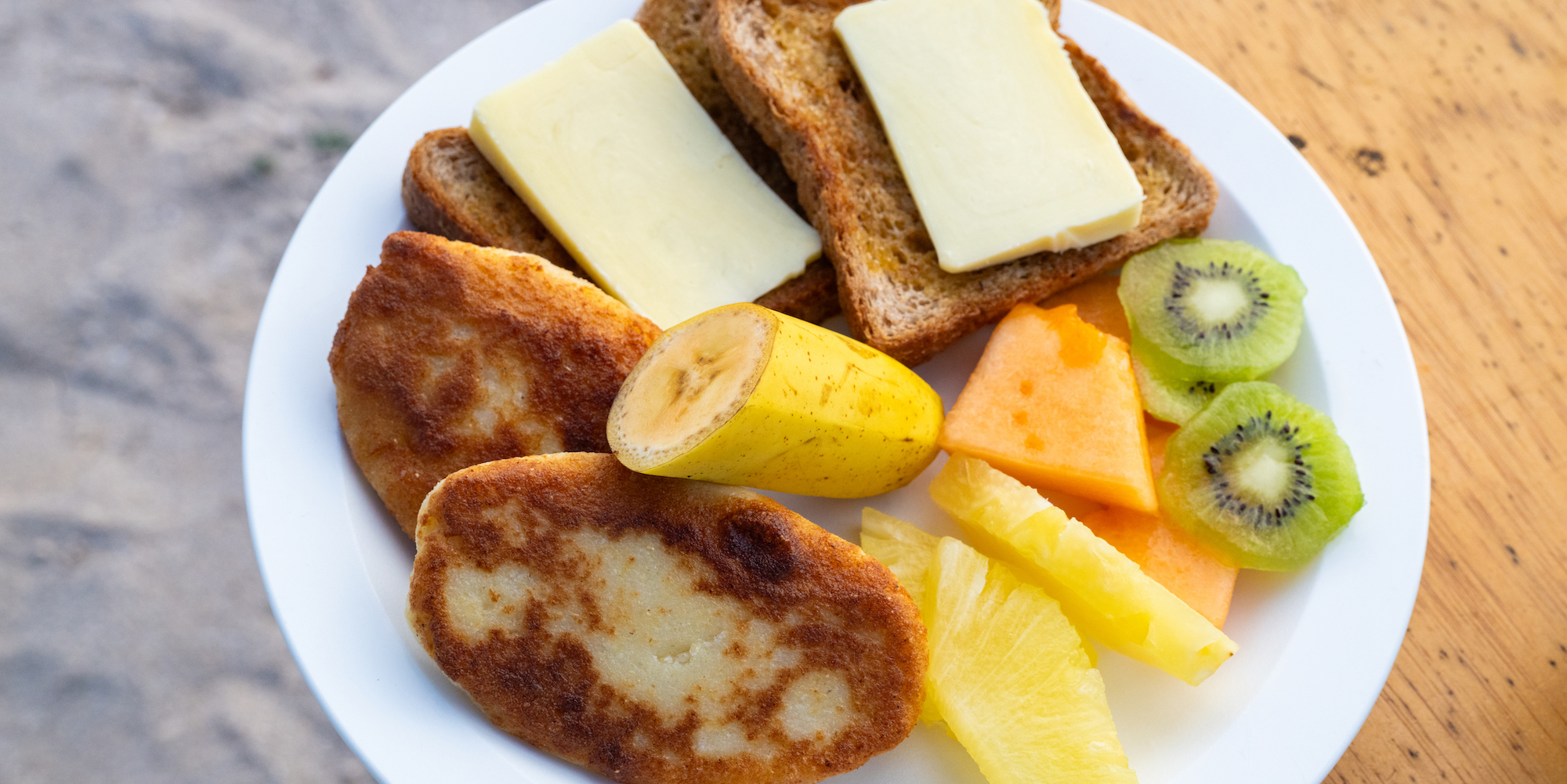 A caassava bread breakfast on a white plate in the Galapagos Islands