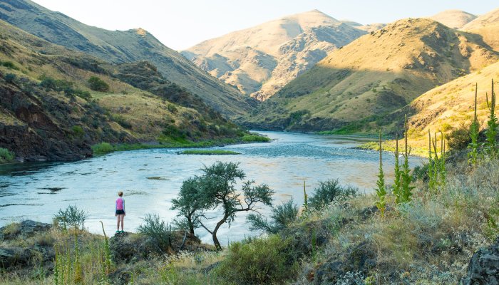 Women standing along the Salmon River looking downstream