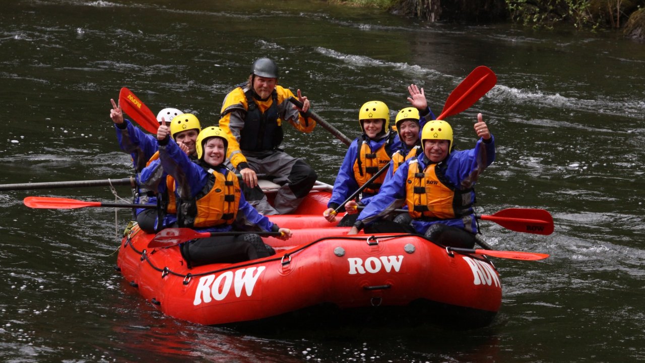Group of people whitewater rafting on a calm section of the Lochsa.