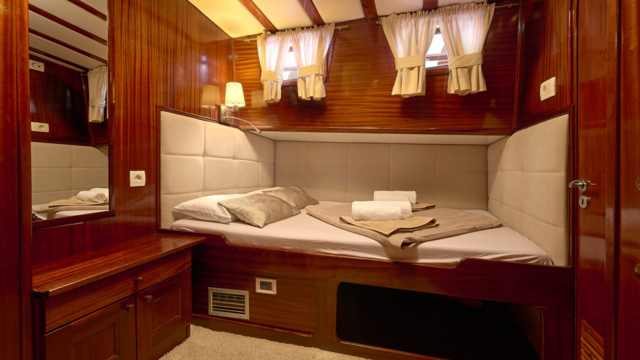small bed in cabin of a yacht