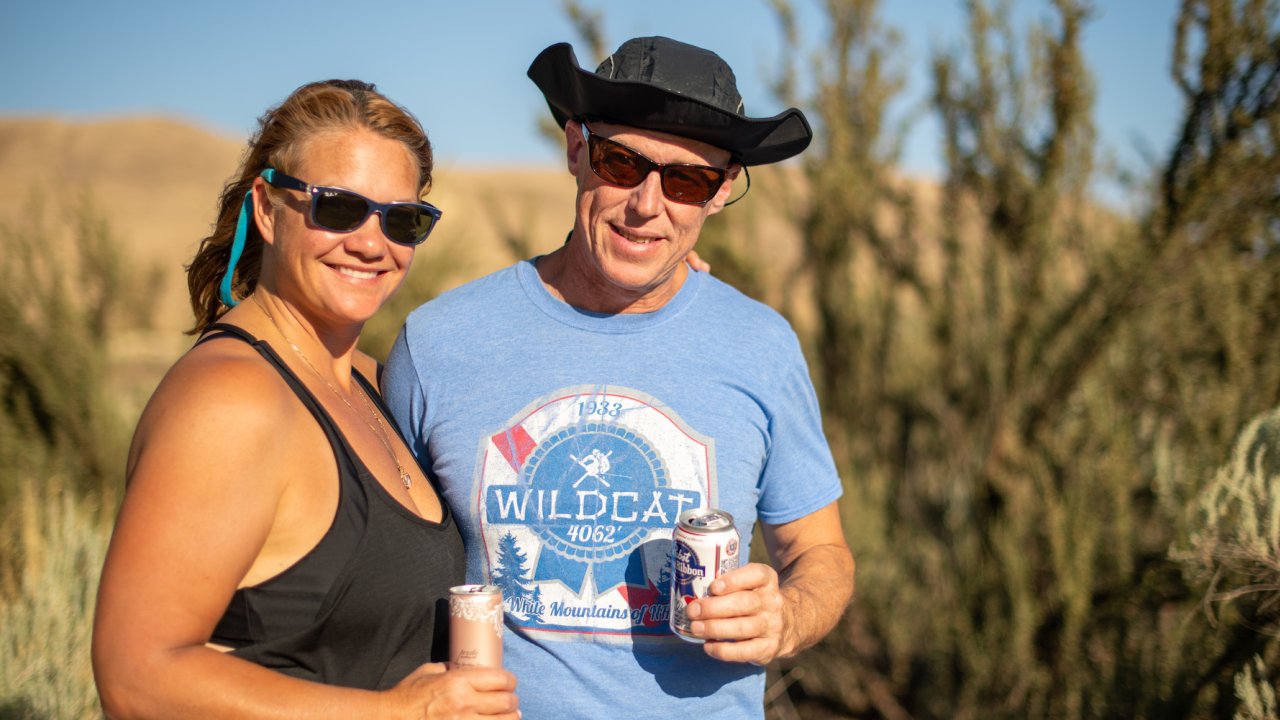 Happy campers on the Deschutes River enjoying beers at sunset