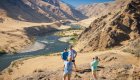 People posing for a photo after hiking up to Suicide Point along Hells Canyon