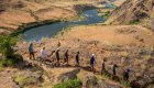 People hiking along Hells Canyon in Idaho during a whitewater rafting trip.