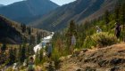 Group hiking along a scenic ridgeline overlooking the Middle Fork of the Salmon River on a multi-day Idaho rafting and hiking adventure.