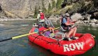 People on a red raft set up with a fishing frame fishing on the Middle Fork Salmon River