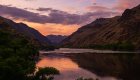 Peaceful sunset over the Salmon River canyon in Idaho, a serene setting for wellness retreats and mindful travel.