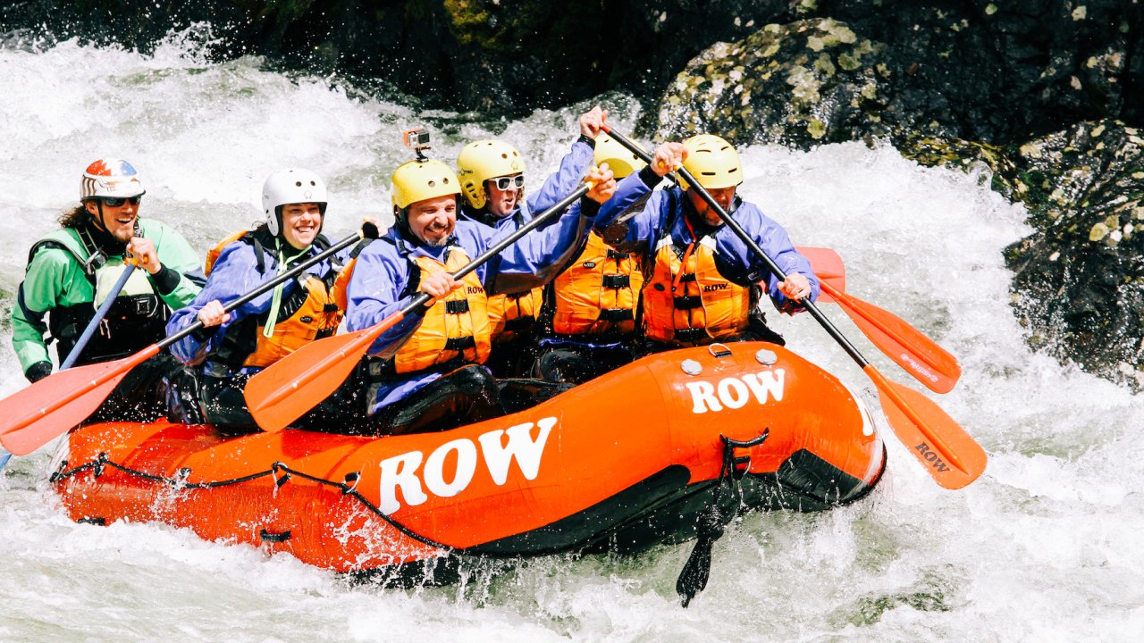 A group of whitewater rafters paddling the Lochsa river in late May