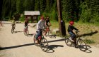 A group of bikers on a guided bike tour on the Hiwatha Route in Idaho.