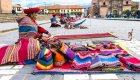 A Peruvian woman weaving traditional blankets in Lima