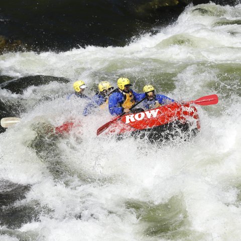 ROW Adventures raft going through a big whitewater wave in the Lochsa River