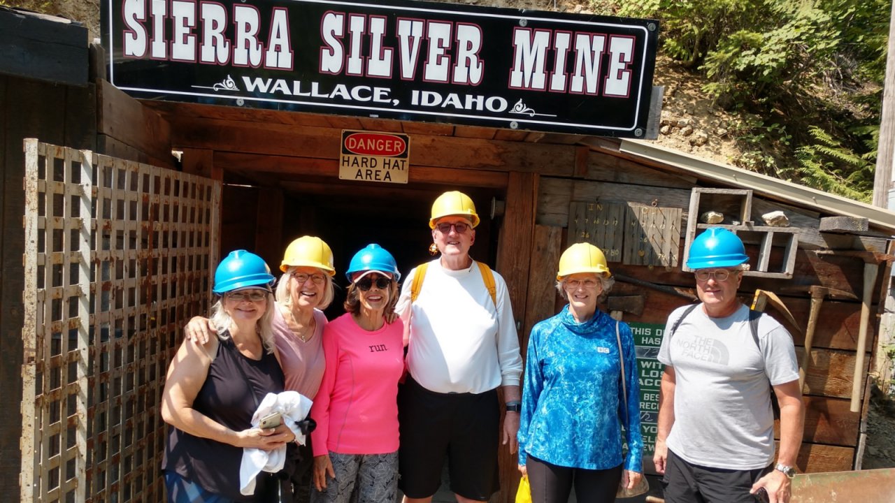 group of people standing outside silver mine