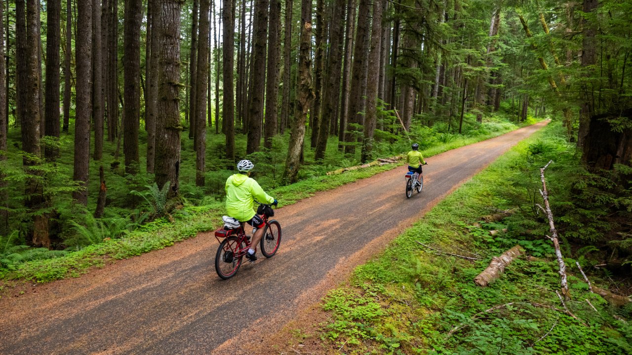 Two people on e-bikes along the Olympic Discovery trail