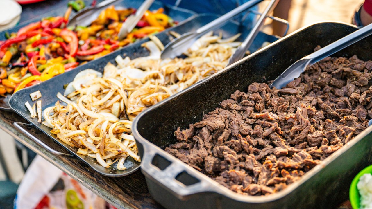 Campfire meal with grilled steak and veggies during a Salmon River main fork adventure.