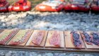 salmon on cedar boards with rafts in the background