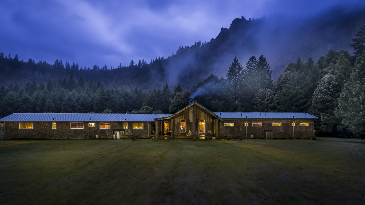 Half Moon Bar Lodge along the Rogue River at dusk