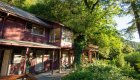 Exterior of one of the Rogue Wilderness Riverside lodges in Oregon