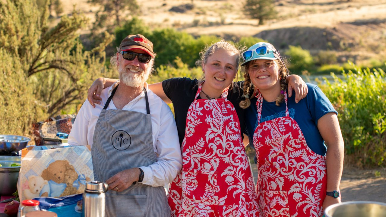 Backcountry cooking along the Deschutes River in Oregon. river guides in aprons
