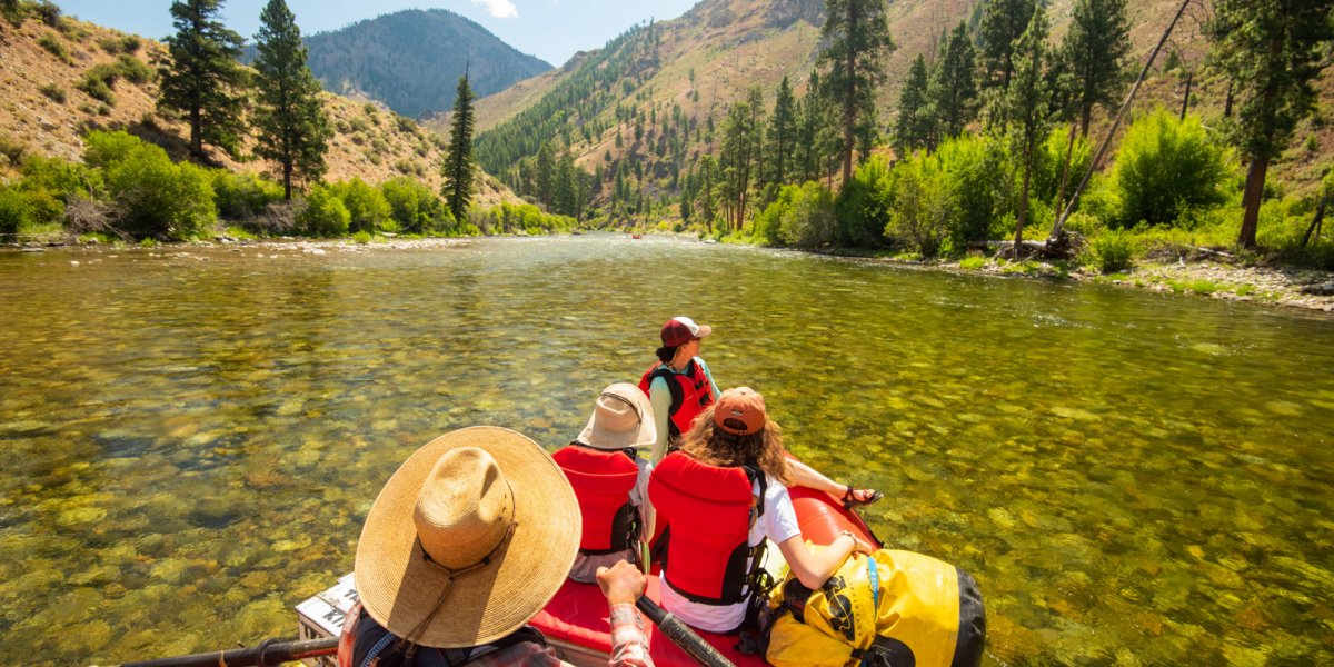 A ROW Adventures Stern Mount Oar Raft floats through a gentle section on the Middle Fork of the Salmon River