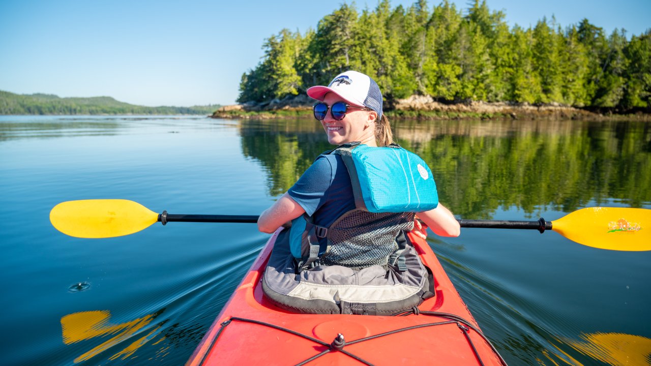 Happy kayaker smiling while on the Pacific Ocean