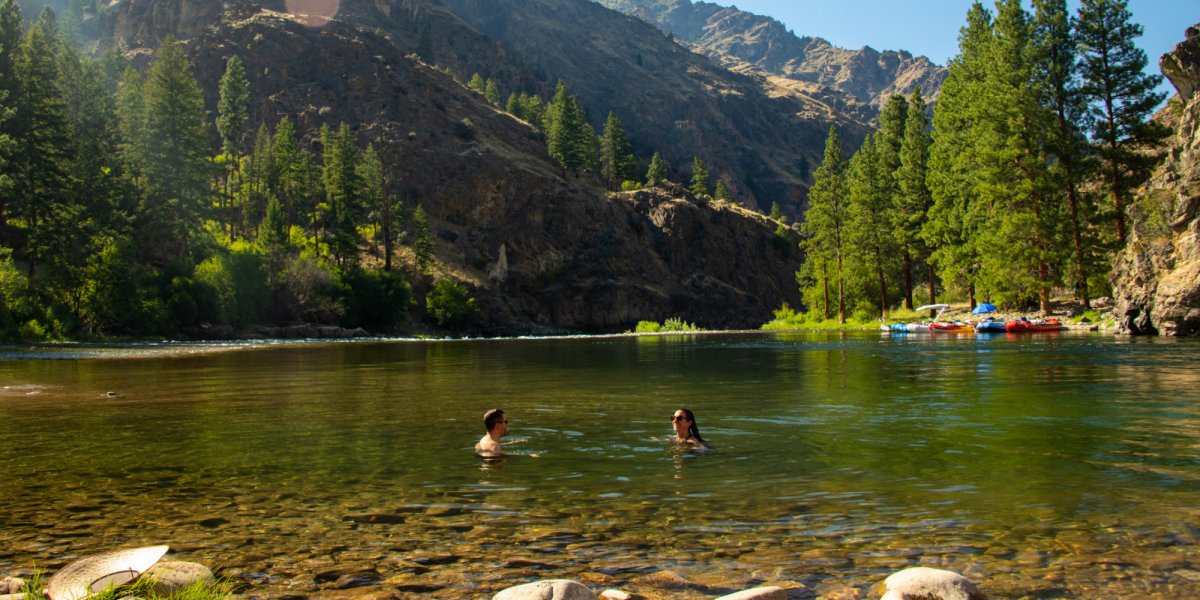 couple swimming in a river