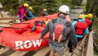whitwater rafters carrying raft down boat ramp