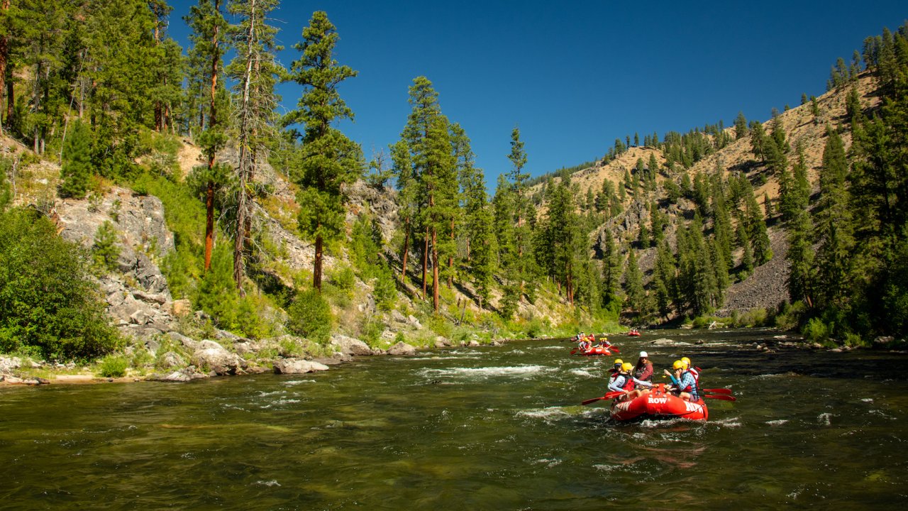 A red raft in the lower right corner of the frame on the Middle Fork Salmon River