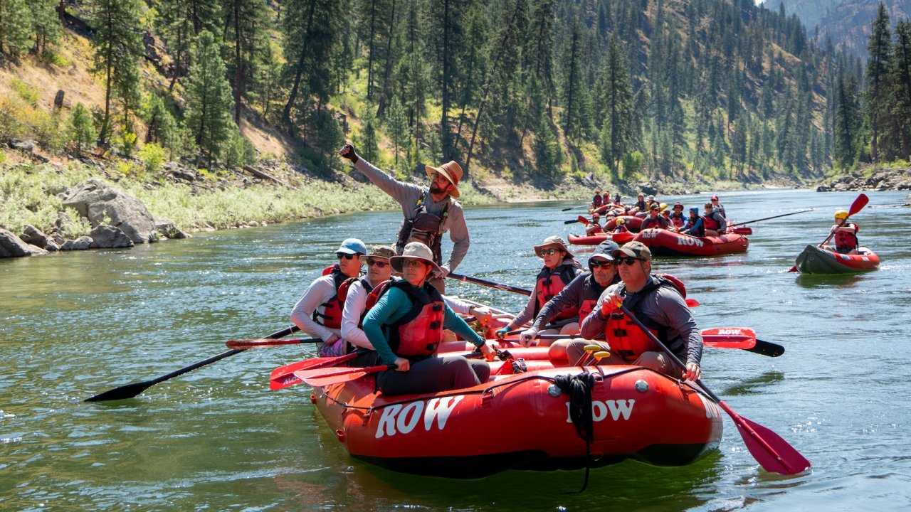 Group floating on calm waters during a salmon river white water rafting Idaho adventure.