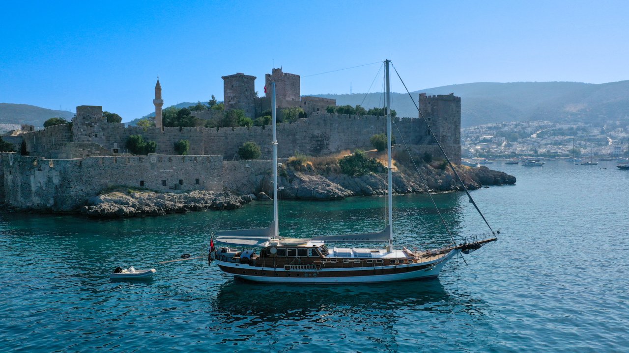 Yaselam Yacht in Turkey in the water with traditional Turkish architecture in the background